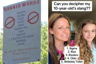 A woman smiling next to a sign