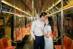 Anastasia Gregory and Spencer Seabaugh kissing on the train. 