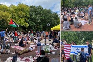 A group of people sitting on the ground with flags protesting at University of Michigan club fair