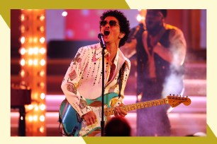 Bruno Mars sings and plays the guitar while wearing sunglasses.