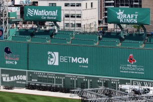 Advertisements for the online sports betting companies BetMGM and DraftKings at Fenway Park.