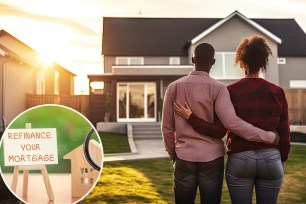 Happy African American couple embracing in front of their new home