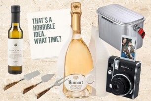 A bottle of Ruinart champagne and clever party napkins as suggested hostess gifts for the summer