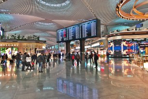 A group of people in the large, bustling terminal of Istanbul Airport, Turkey on March 20, 2021.