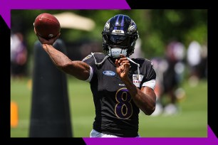 Lamar Jackson throws a pass.