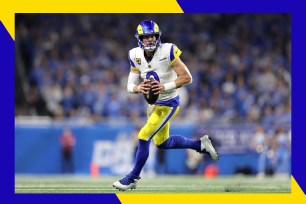 Los Angeles Rams quarterback Matthew Stafford looks to throw a pass.