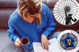 A woman sitting on a couch reading a book with a cup of coffee nearby.