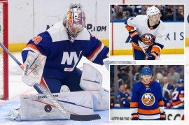 Islanders goalie Ilya Sorokin makes a save; Adam Pelech; Noah Dobson