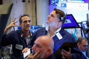 The Dow Jones Industrial Average hit an all time high of 41,585.21 before closing at 41,563.08.